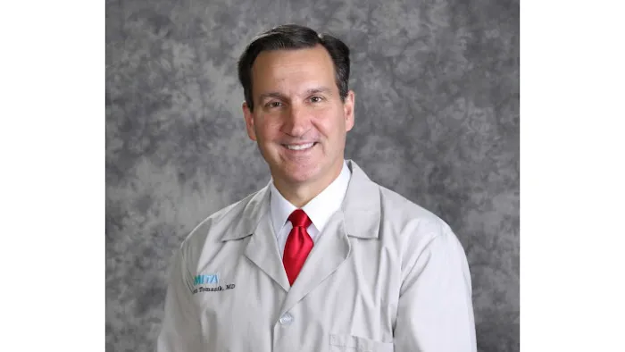 Scott E. Tomasik, MD 1